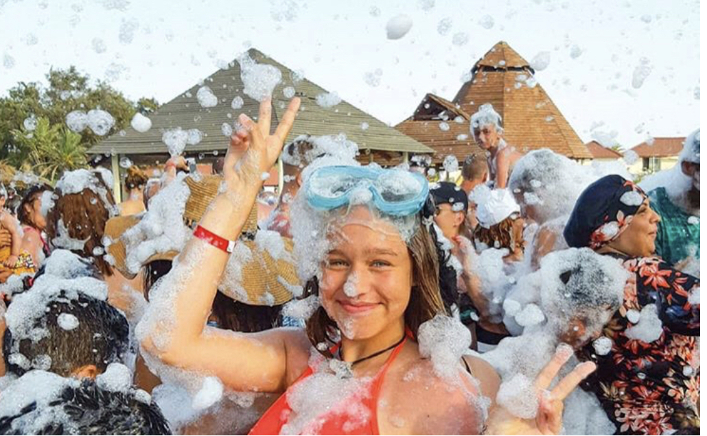 Teen with goggles in foam - Foam Zone Texas foam party rentals Friendswood, TX